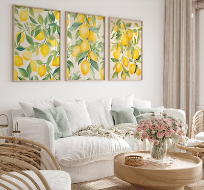 A cozy room with a white sofa, lemon-themed wall art, and a bouquet of pink flowers on the table.