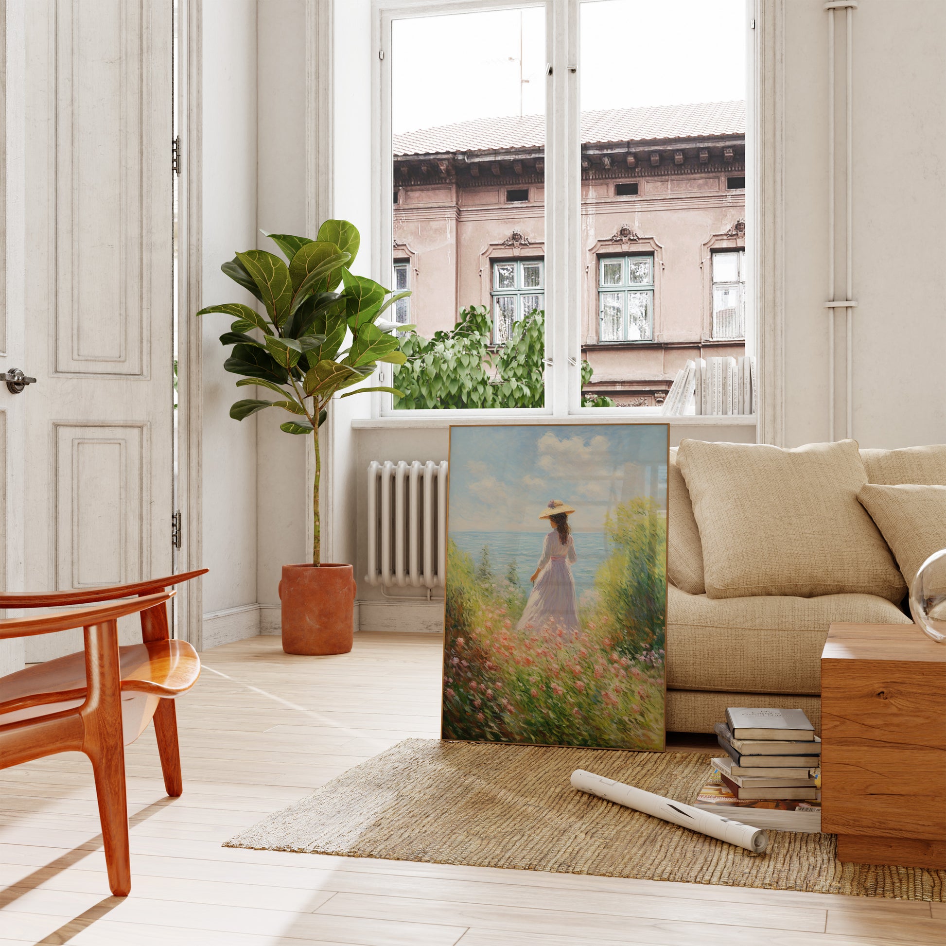 A cozy living room with a large painting propped on the floor next to a sofa.