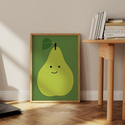 A framed poster of a cartoon pear on the floor leaning against a wall beside a wooden table.