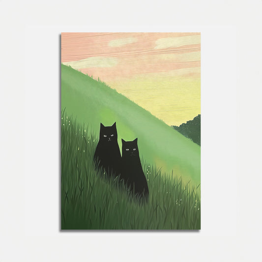 A painting of two black cats sitting on a grassy hill at sunset.