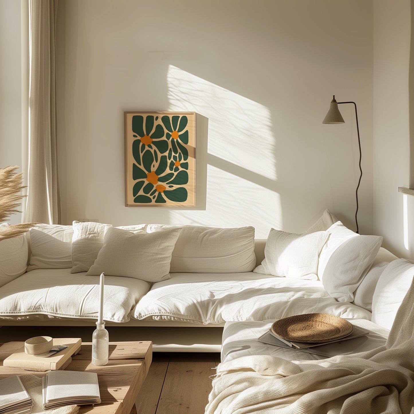 Cozy, sunlit living room with a white sofa, wall art, and a floor lamp.