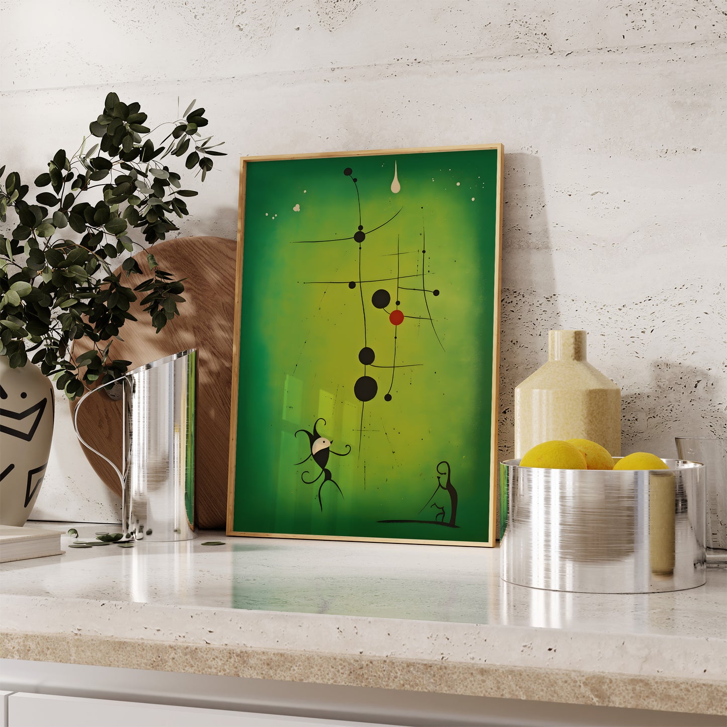 Modern abstract art in a frame on a kitchen countertop with decorative vases and plant.