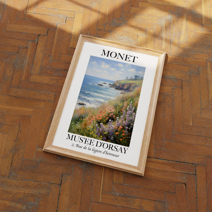A framed Monet poster on a wooden floor.