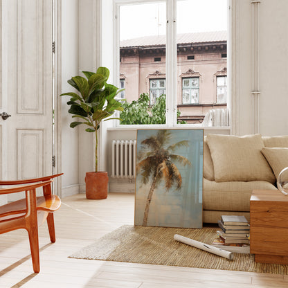 A cozy living room with a sofa, plants, and a painting leaning against the wall.