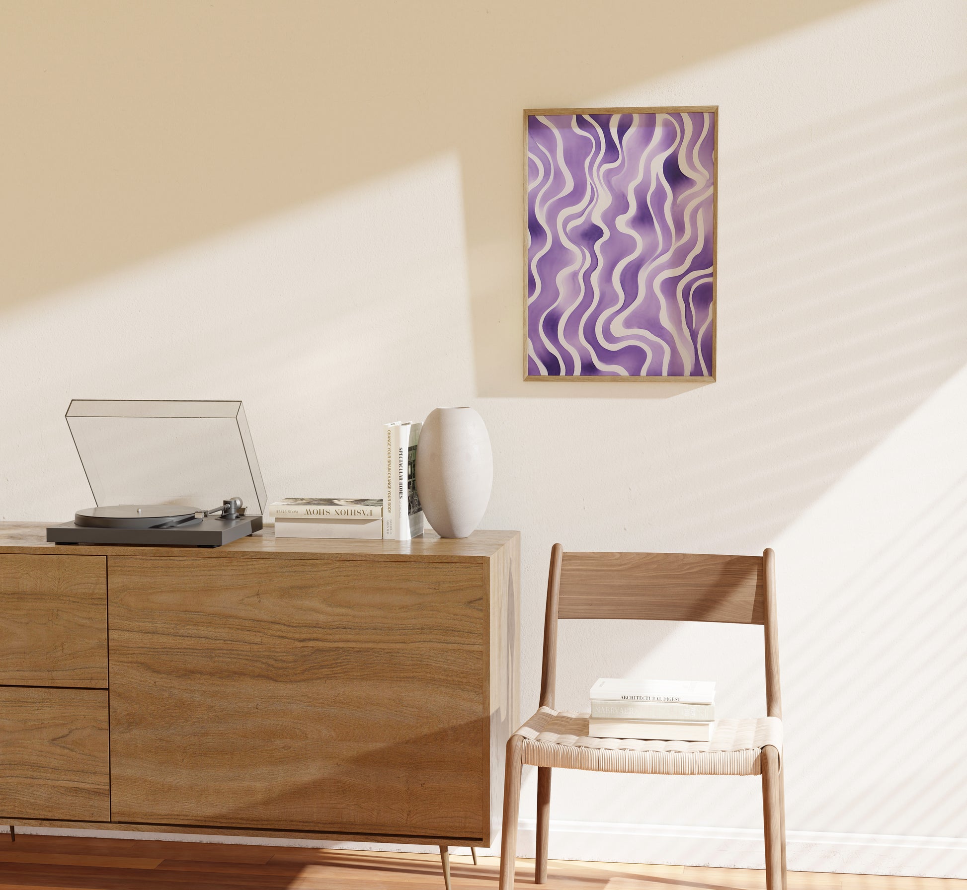 Modern room with a wooden cabinet, turntable, chair and abstract wall art.