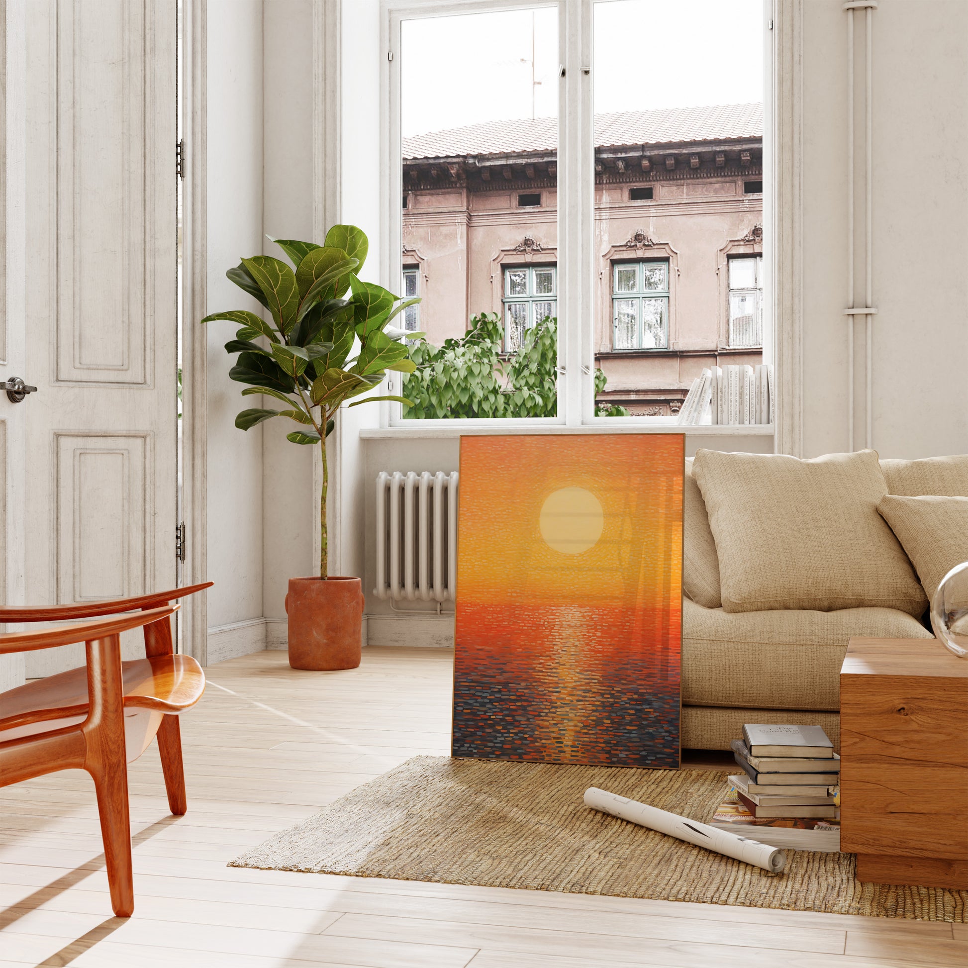 A modern living room with a sofa and a large painting leaning against the wall.