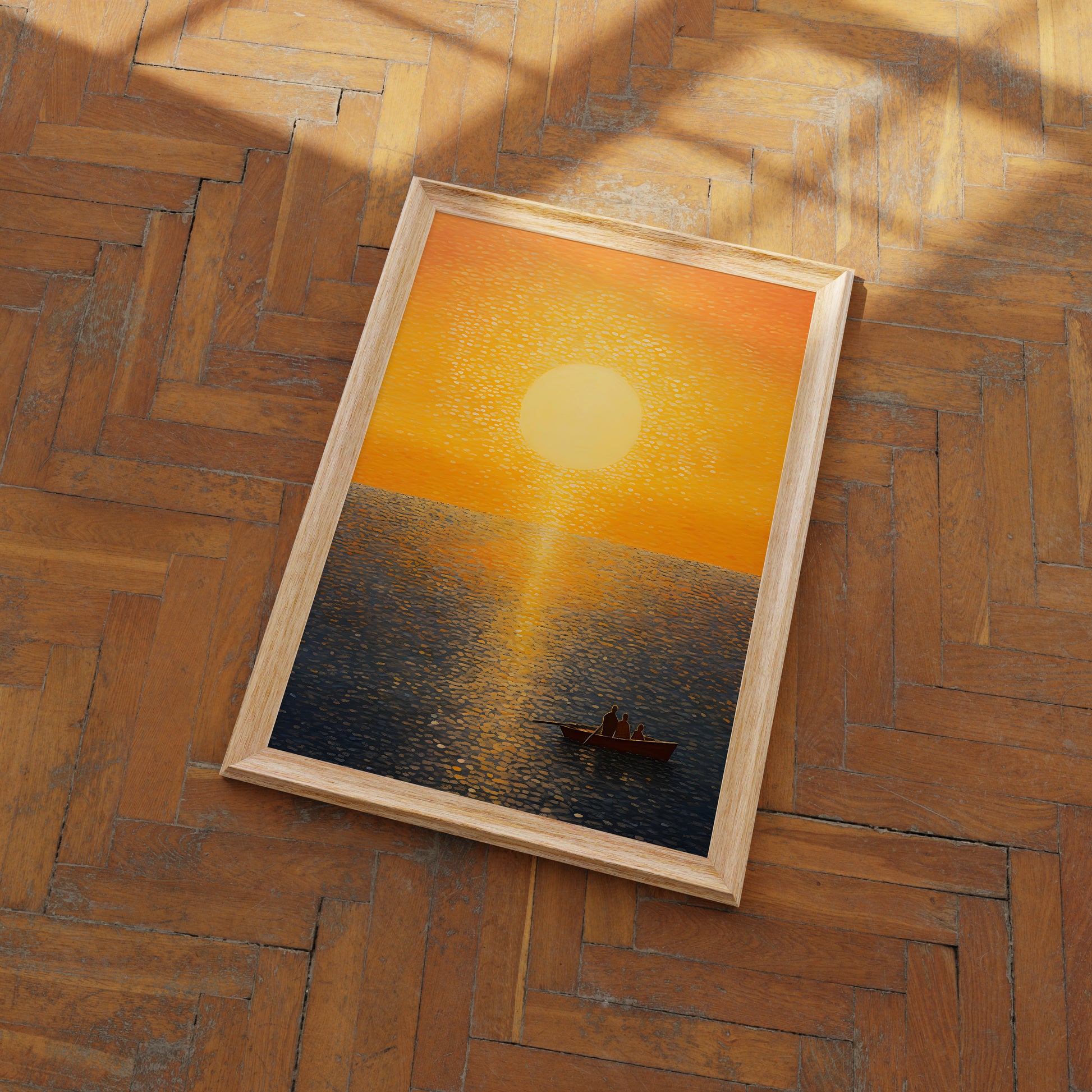 A framed painting of a sunset over the sea with a boat on a parquet floor.