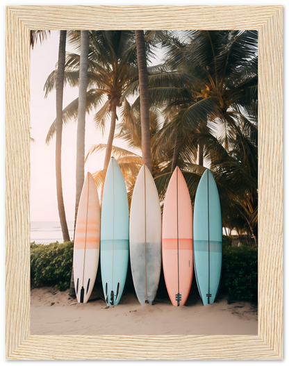 Five surfboards leaning against a palm tree on a sunny beach.