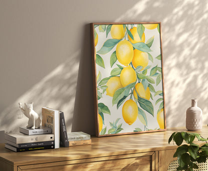 A framed lemon print leaning against a wall on a wooden sideboard with books and decor items.