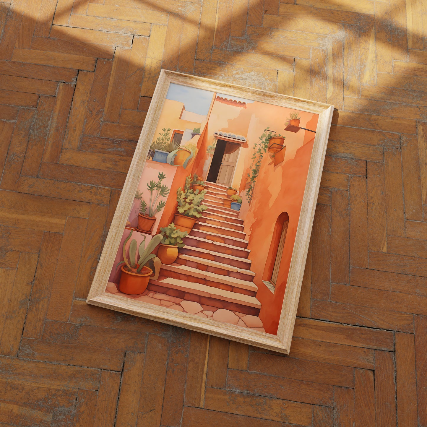 A framed painting of a Mediterranean-style staircase with plants on a wooden floor.