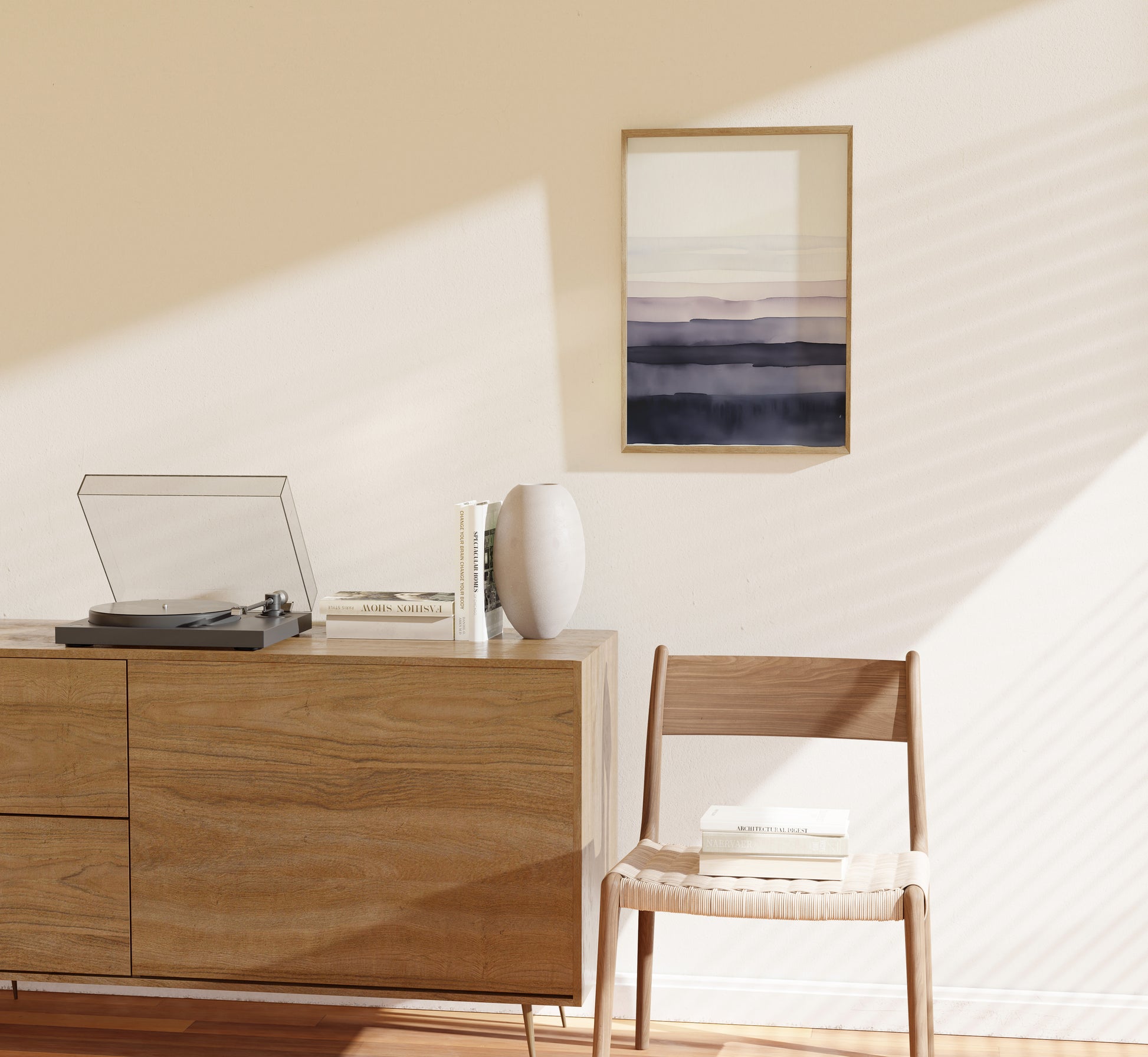 Modern living room corner with a wooden cabinet, turntable, framed art, and chair.