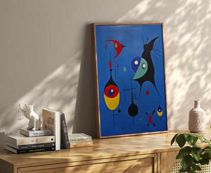 A modern abstract painting on a wall above a shelf with books and decorative items.