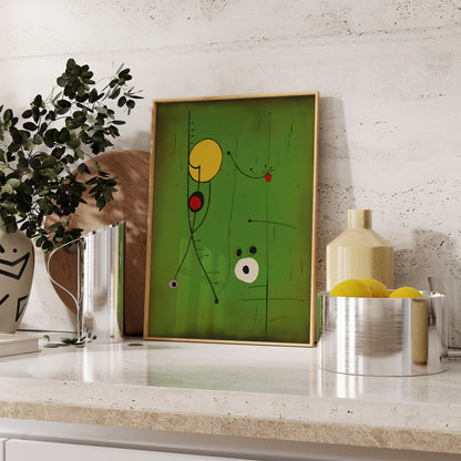 Abstract green and yellow artwork with geometric shapes leaning against a wall on a kitchen counter.