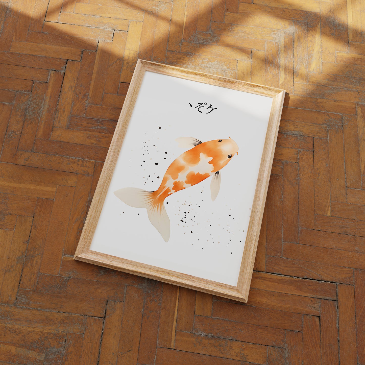 A framed illustration of an orange and white koi fish on a wooden floor.