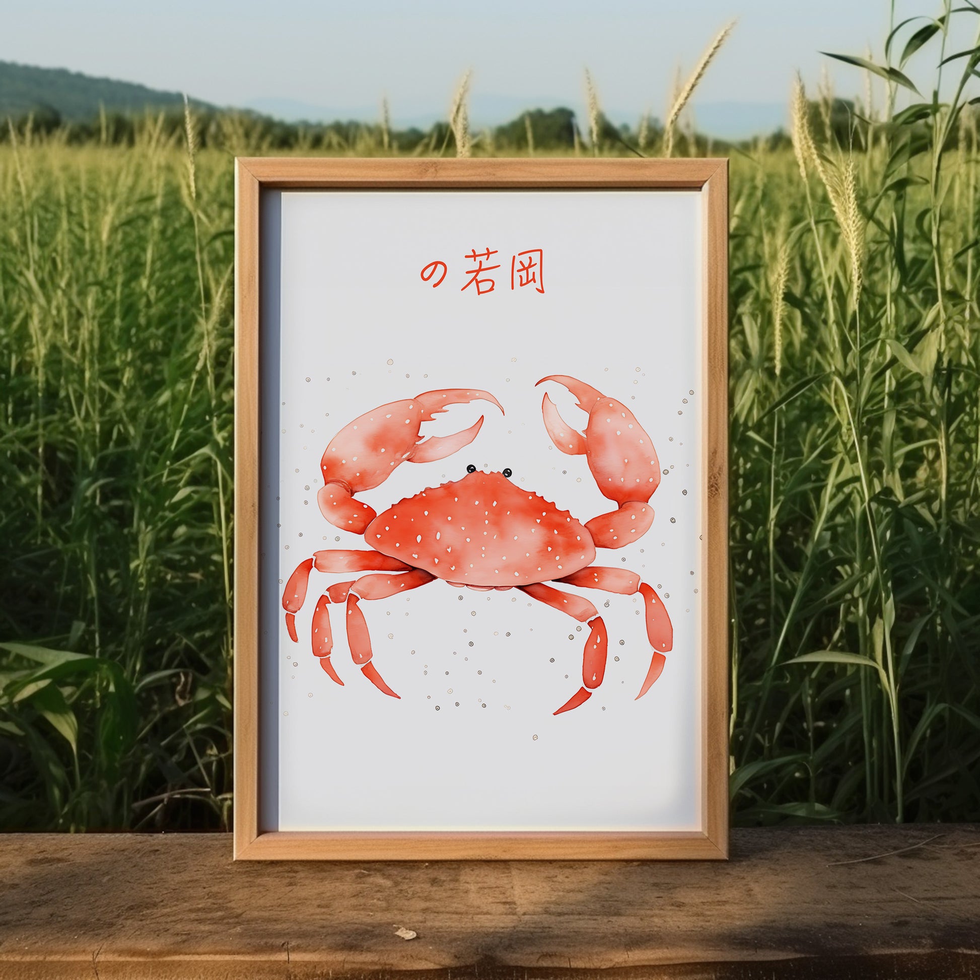 A framed illustration of a red crab with Japanese text against a grassy background.