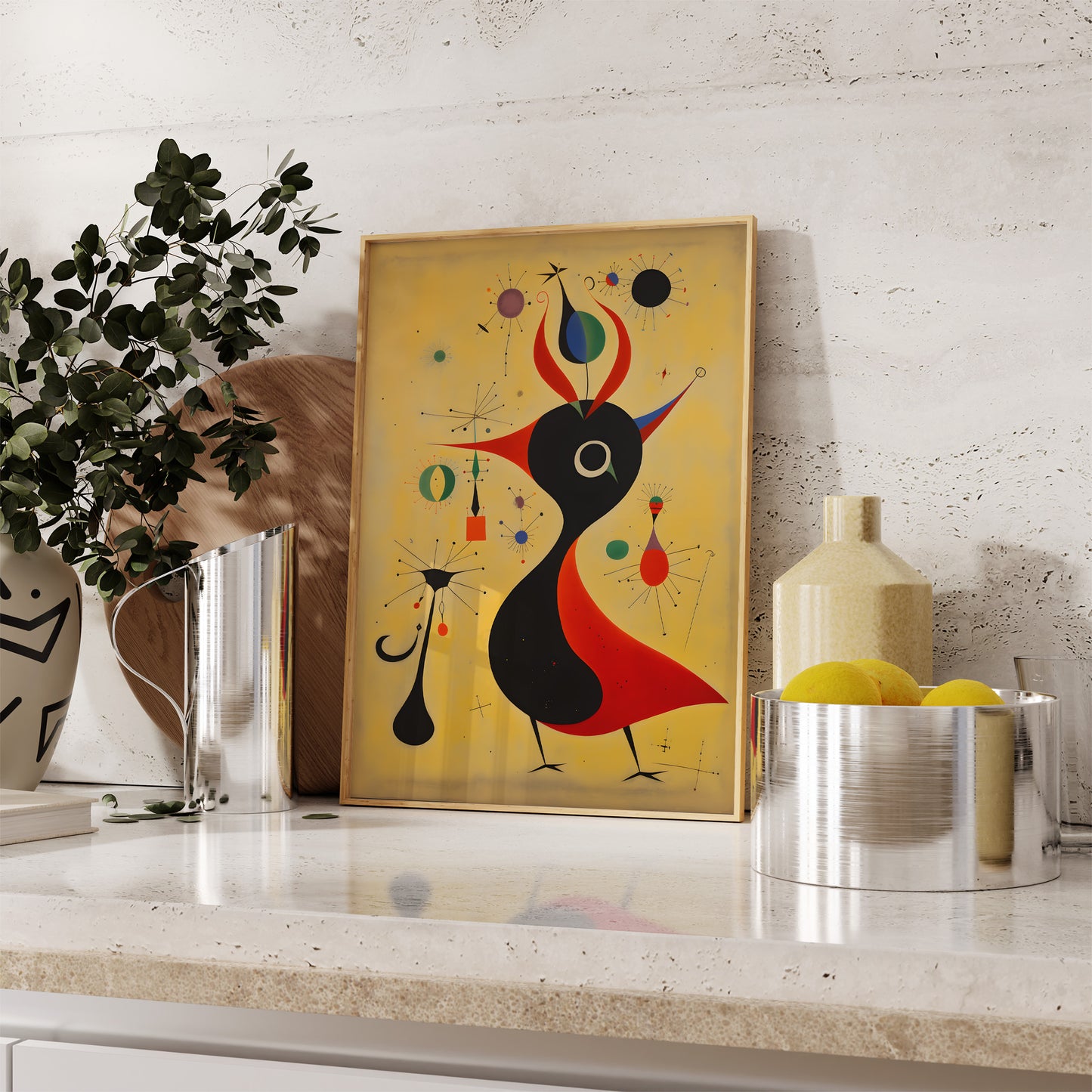 Abstract art painting leaning against a wall on a kitchen countertop beside decor items.