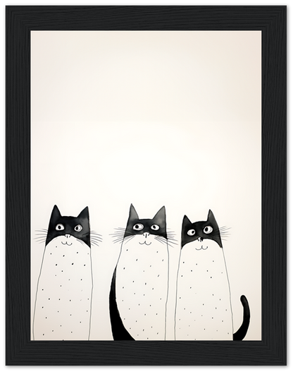 Illustration of three black and white cats with wide eyes framed on a wall.