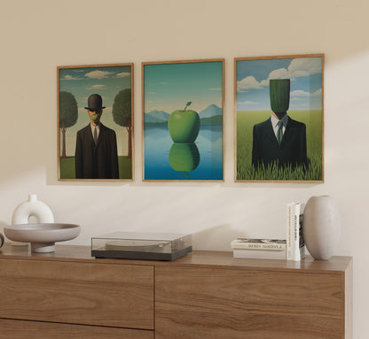 Three framed paintings in a modern room depicting men with obscured faces in surreal landscapes.