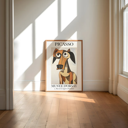 A Picasso exhibition poster featuring a stylized dog, placed in a room with sunlight casting shadows.