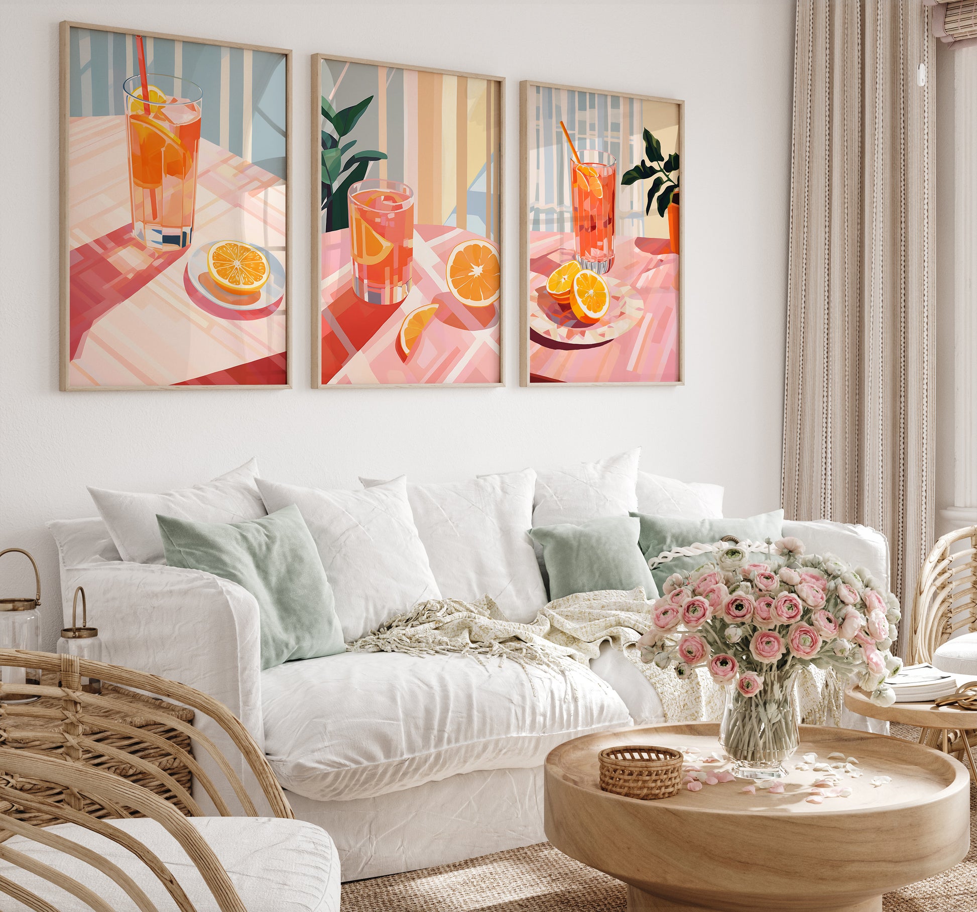 Three citrus-themed art pieces above a cozy sofa in a well-decorated living room.