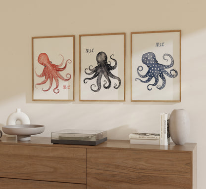 Three framed octopus illustrations in red, black, and blue on a wall above a wooden cabinet.
