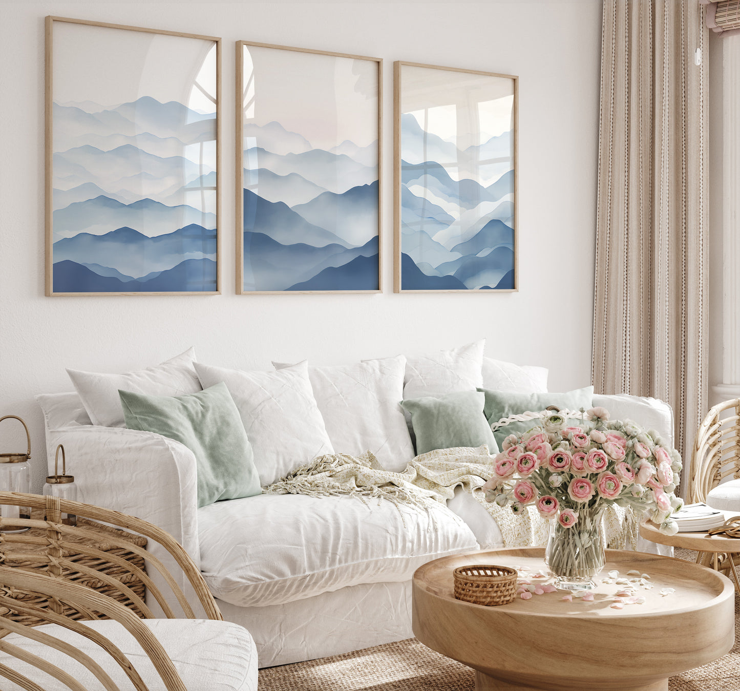 Cozy modern bedroom interior with mountain paintings, white bedding, and a bouquet of pink flowers on a wooden table.