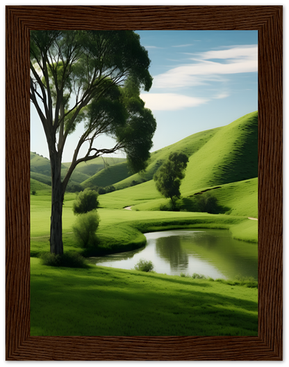 A framed image depicting a serene landscape with green hills, trees, and a small pond.