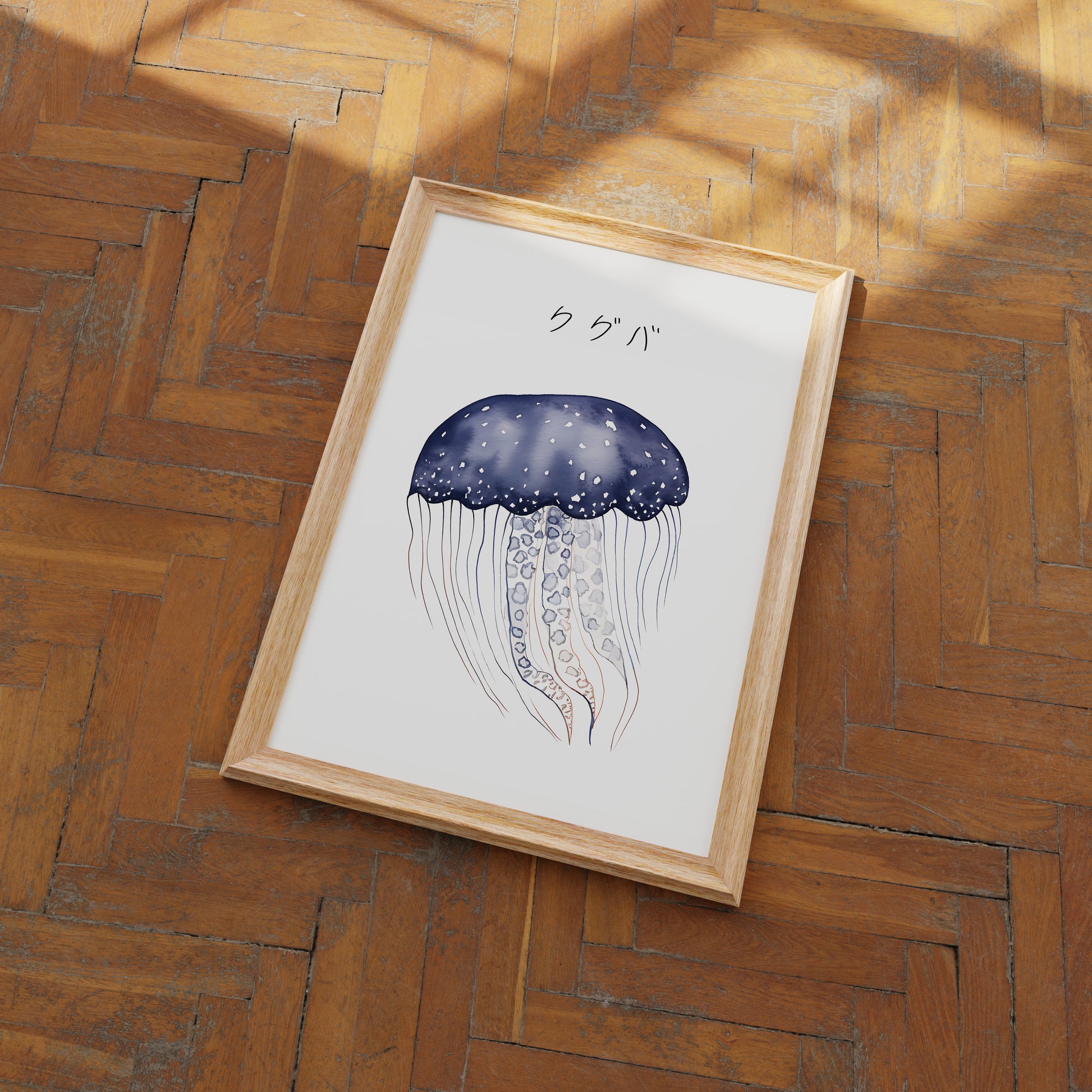 A framed illustration of a jellyfish on a wooden floor.