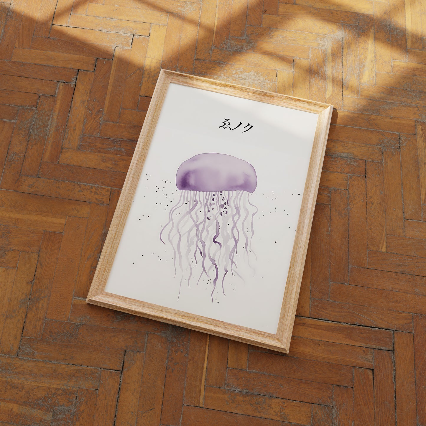 Framed jellyfish illustration on a herringbone wood floor.
