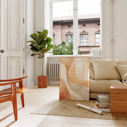 A cozy living room with a sofa, plants, and an abstract painting, facing an open balcony door.