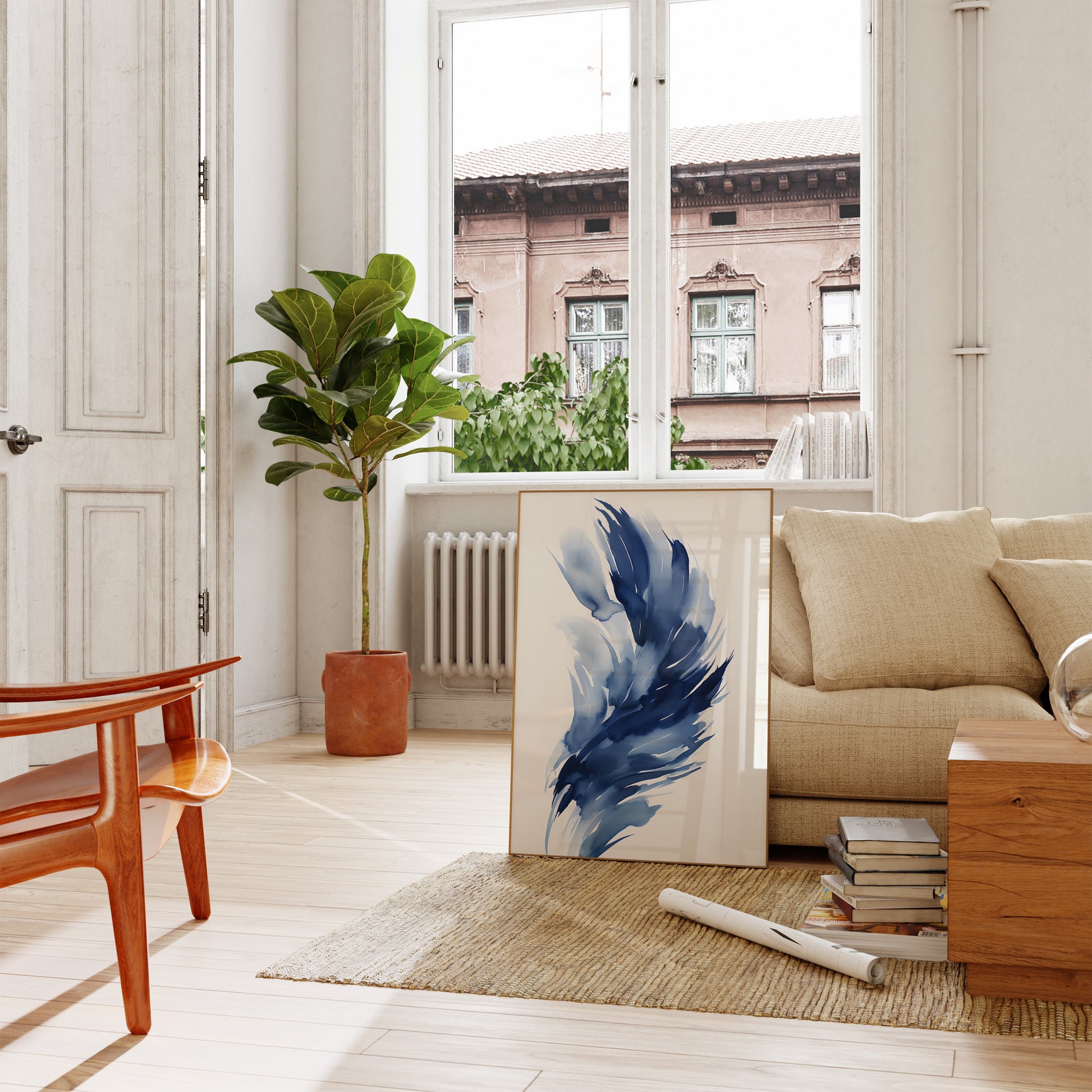 A cozy living room with a sofa, modern artwork, and a potted plant.