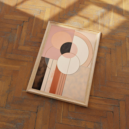 A framed abstract art piece with circular shapes on a herringbone wood floor.