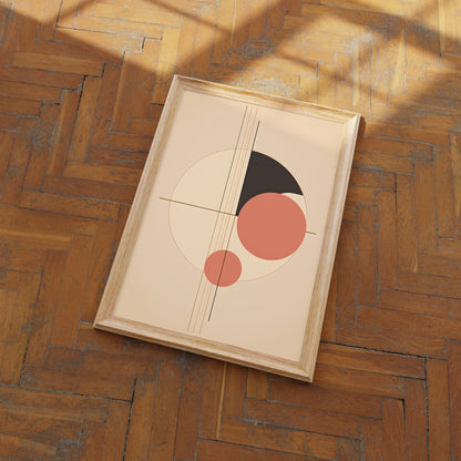 Abstract framed artwork with geometric shapes on a wooden floor.