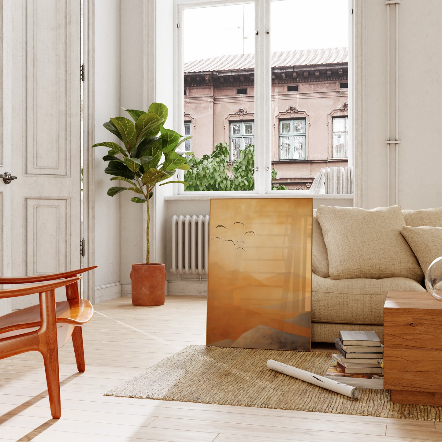 Bright living room with a beige sofa, wooden coffee table, plants, and artwork.