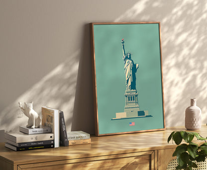 A framed poster of the Statue of Liberty leaning against a wall beside decorative items.