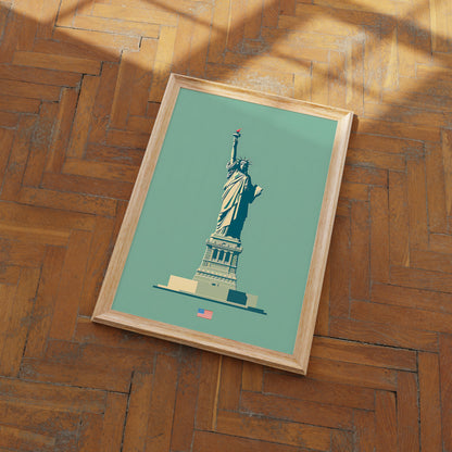 Framed poster of the Statue of Liberty on a wooden floor.