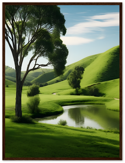 A framed image depicting a serene landscape with green hills, trees, and a small pond.