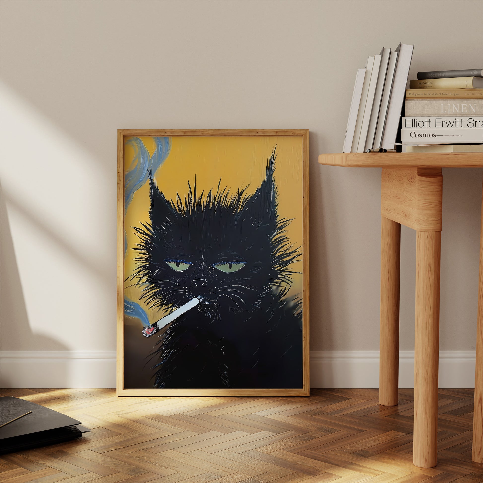 A framed poster of a black cat with green eyes on a floor leaning against a wall.