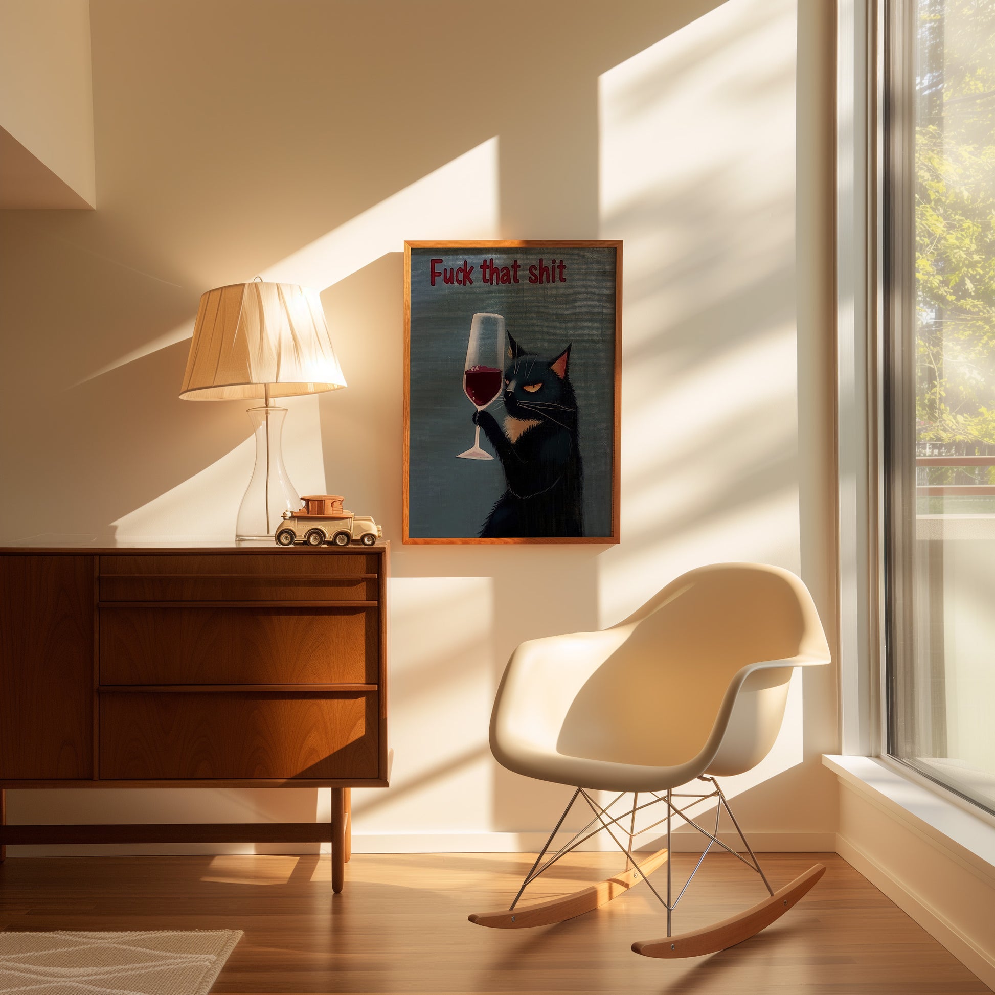 A cozy room with a rocking chair, sideboard, and a lamp, with an artwork containing explicit language.
