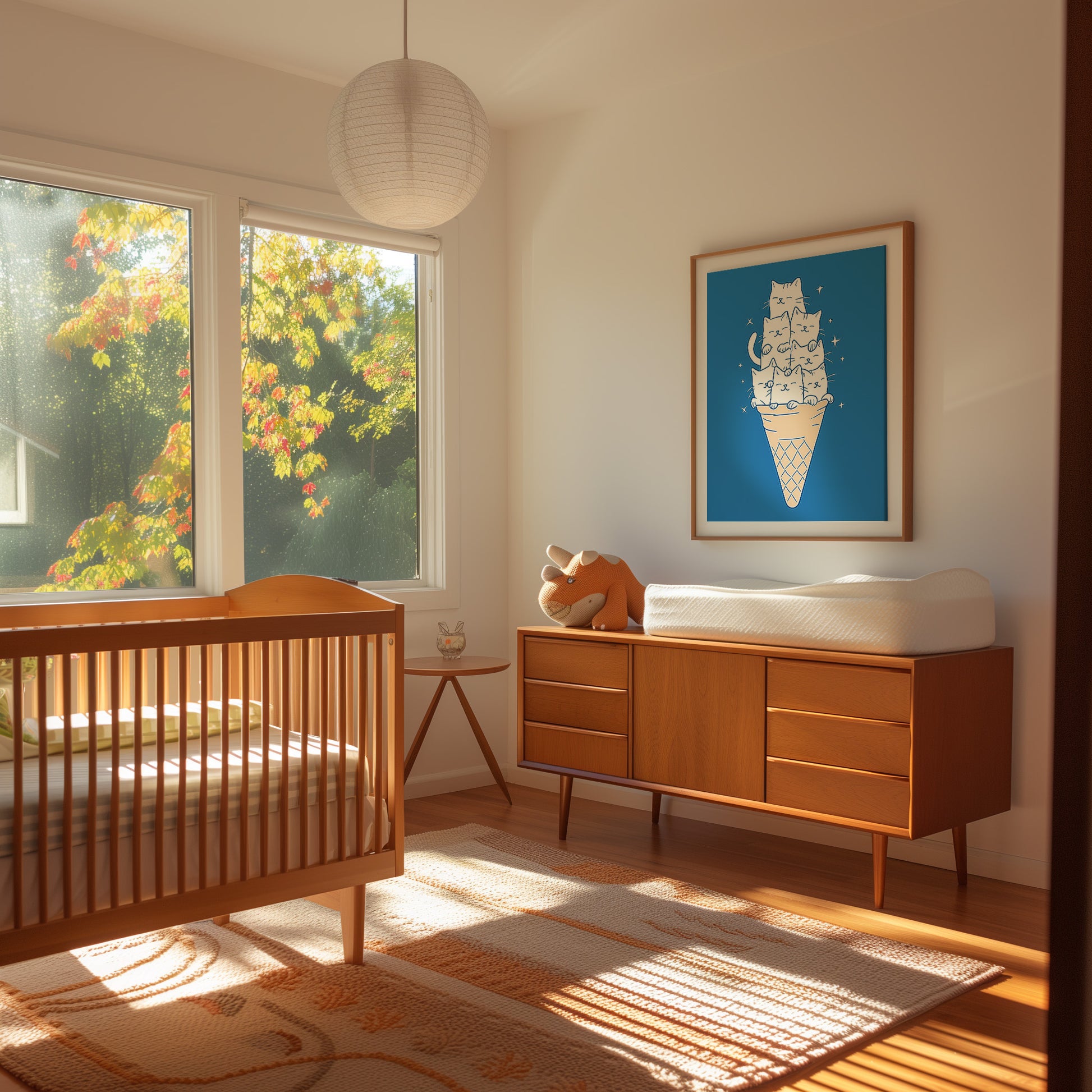 A cozy nursery room with a crib, dresser, and a colorful framed cat poster on the wall.