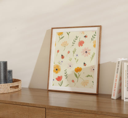 A framed floral print on a wooden shelf beside books and a woven basket.