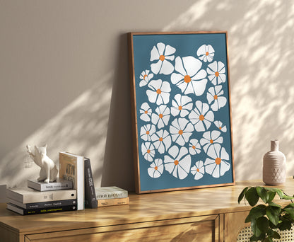 An elegant floral painting beside books and decorative items on a shelf.