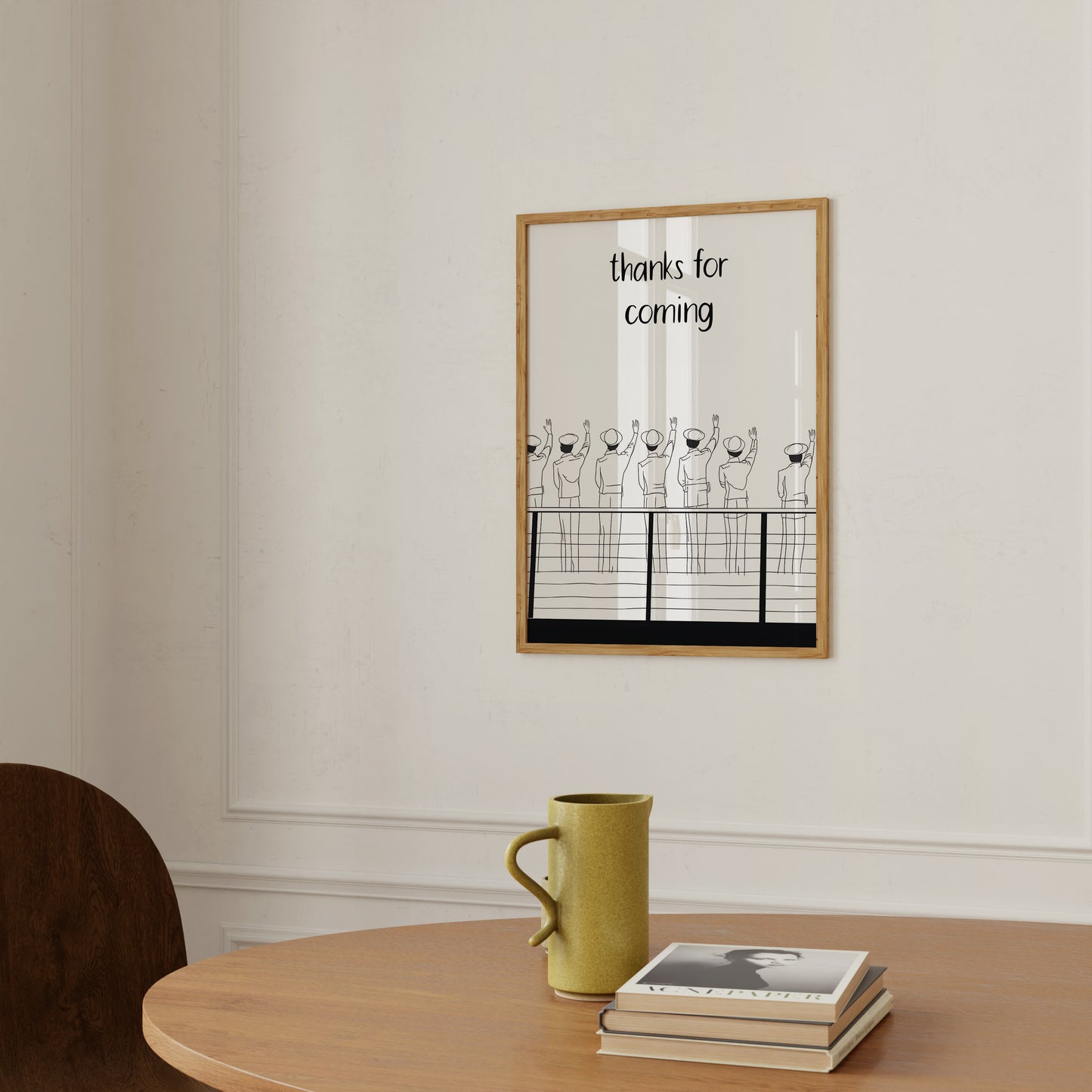 A framed illustration on a wall with the text "thanks for coming" above playful line drawings.