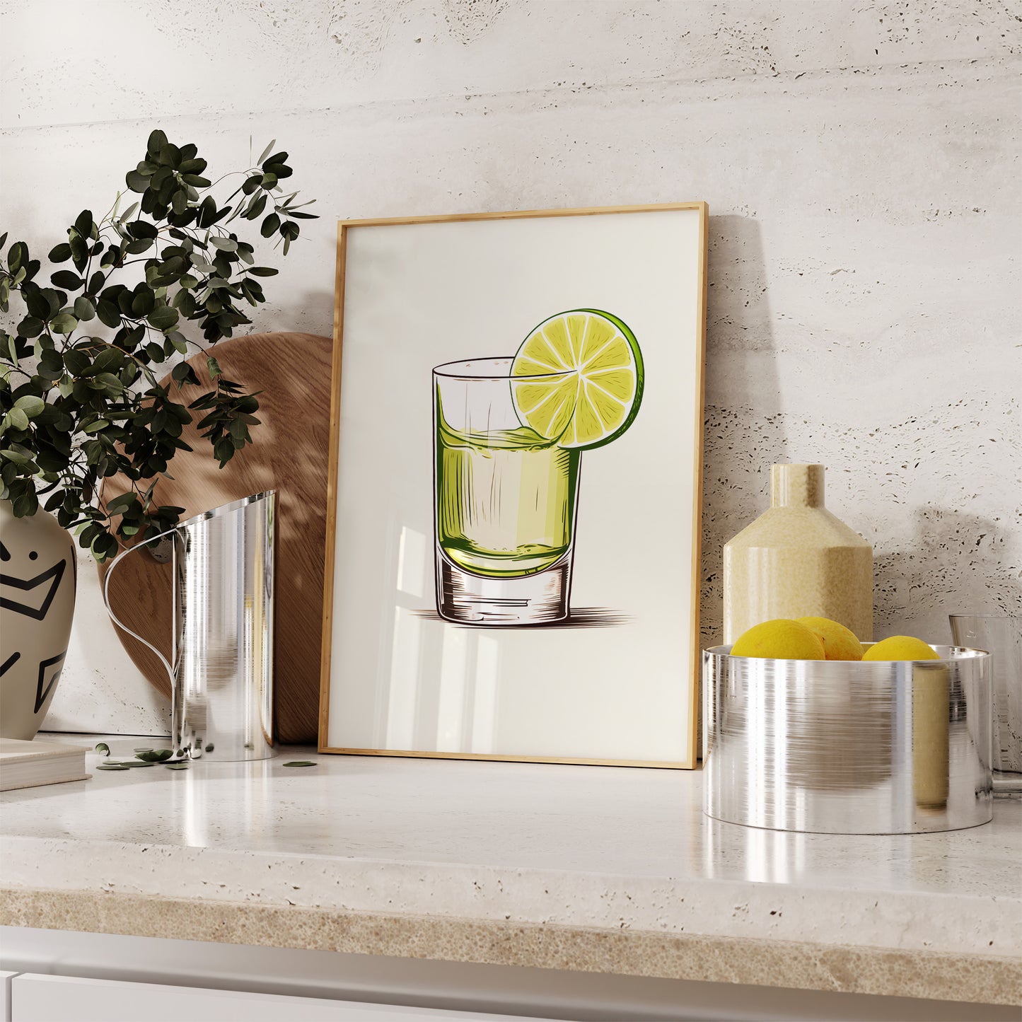 A framed illustration of a lime drink on a kitchen counter.